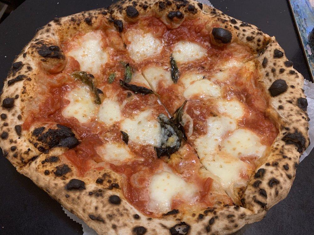 Margherita Pizza · Tomato sauce, fior di latte, and basil.