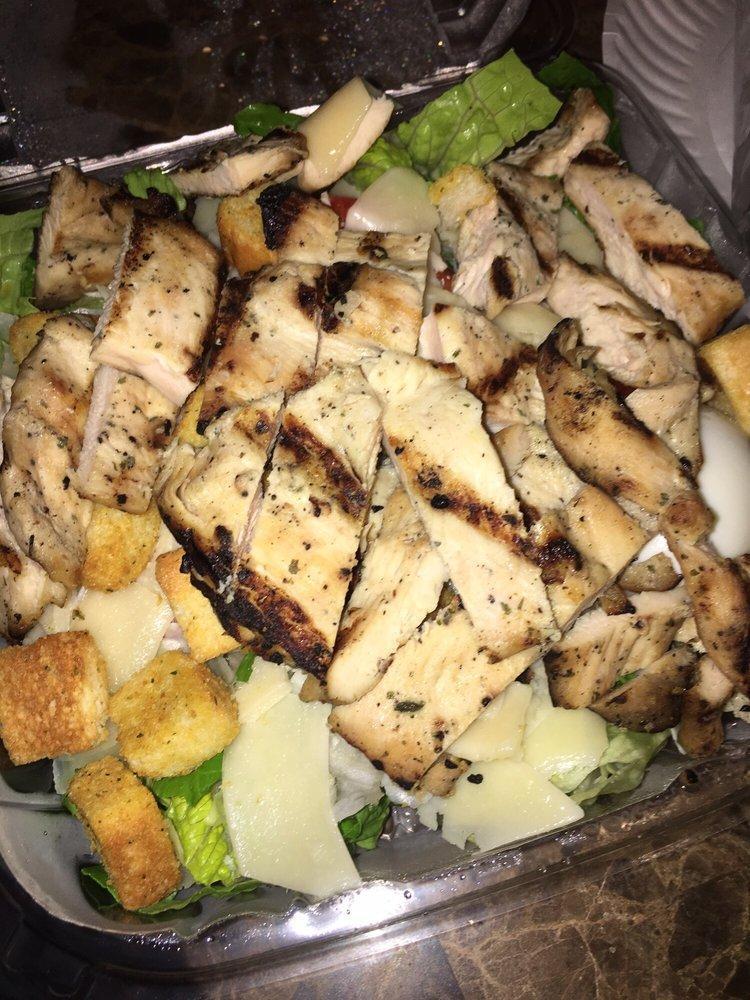 Grilled Chicken Caesar Salad · Romaine lettuce, sweet pepper, boiled eggs, grilled chicken strips, croutons and Caesar dressing.