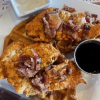 Chicken and Waffles · Buttermilk fried chicken, country gravy, waffles, maple syrup and candied bacon crumbles.