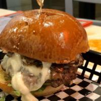 Shroom Burger · Beef patty, with aged melted Swiss cheese, topped with freshly made guacamole, pico de gallo...
