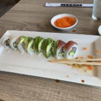 San Antonio Roll · Yellowtail hamachi, fresh salmon, avocado, topped with white fish, tuna, masago, avocado and...