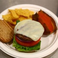 Bison Burger · Premium lean Canadian bison burger with lettuce, tomatoes, onions and low-fat mozzarella. Se...