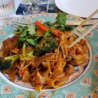 Railroad Track Noodles · Wide flat rice noodles sauteed with egg, broccoli, and Thai basil in garlic Thai herb sauce....