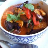 Red Curry · Medium hot. Served with Thai pumpkin and  bamboo shoots and Thai basil in red curry - coconu...