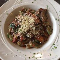 Portabella Mushroom Gnocchi · Sauteed fresh portabella mushroom slices in a garlic tomato spinach sauce over spinach gnocc...