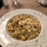 Seafood Gnocchi · Sauteed shrimp and scallops in a lobster sauce over gnocchi and topped with Romano cheese an...
