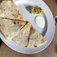 Quesadilla · Flour tortilla stuffed with cheese, mushrooms, poblano pepper, caramelized onions, topped wi...