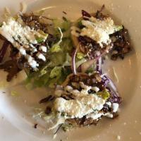 Sope · 3 corn masa sopes topped with your choice of rajas, al pastor or carnitas with sour cream an...