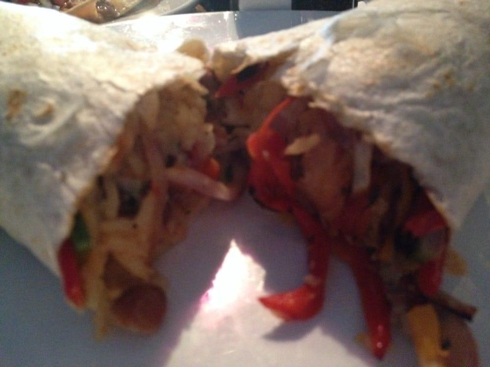 Veggie Burrito · Flour tortilla filled with rice, beans, cheese, bell pepper, mushrooms and onion.
