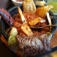 Molcajete Mixto · Grilled steak, grilled chicken and shrimp molcajete. Comes with grilled chicken, grilled cac...