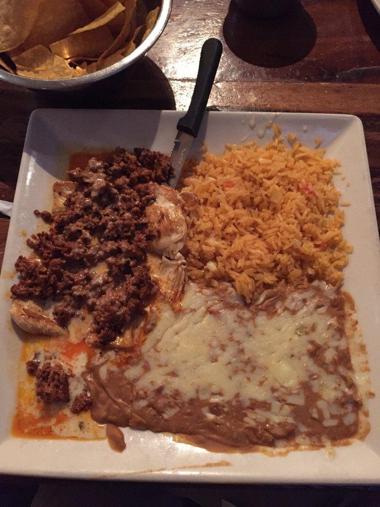 Chori Pollo · Gluten free. Grilled chicken breast topped with chorizo and drizzled cheese sauce. Served with a side of rice and beans.