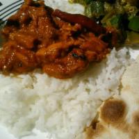 Chicken Tikka Masala · Marinated and spiced chicken in curry. Served with rice.