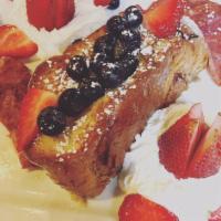 Stuffed French Toast · 2 slices of challah French toast ( secret recipe batter) topped with whip cream, seasonal fr...