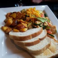 Tofu Scramble · Firm tofu, mushrooms, red onions, zucchini, tomatoes, spinach and topped with avocado. Add s...
