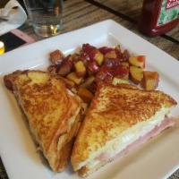 Monte Cristo · Challah bread dipped in our special french toast batter, grilled with turkey, ham & Swiss ch...