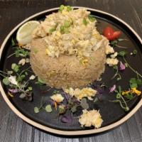 Crab Fried Rice · Sauteed egg, crab meat, white rice, garlic, onion and tomato with Thai stir-fry sauce.
