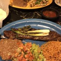 Carne Asada · Char-broiled skirt steak served with pico de gallo, grilled onions and guacamole.