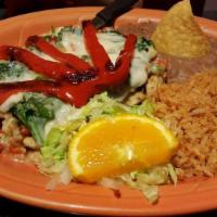 Spinach Enchiladas · 3 soft tortillas stuffed with spinach topped with tomato sauce, melted cheese and sour cream.