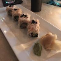 Stoned Crab Makimono · Shrimp tempura, avocado, cucumber, crab salad, lime zest, cilantro and black tobiko.