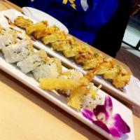 Godzilla Roll · Inside: salmon, shrimp, crab, eel, asparagus, then deep fried. Outside: scallion, masago and...