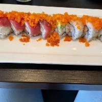 San Antonio Roll · Yellowtail hamachi, fresh salmon, avocado, topped with white fish, tuna, masago, avocado and...