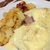 Eggs Benedict · Thomas English muffin topped with Canadian bacon, 2 poached eggs and homemade hollandaise sa...
