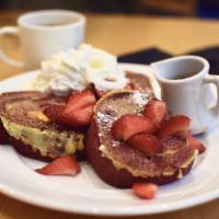 Red Velvet French Toast · Red velvet cake with swirls of cream cheese, dipped in our secret batter and grilled. Topped...
