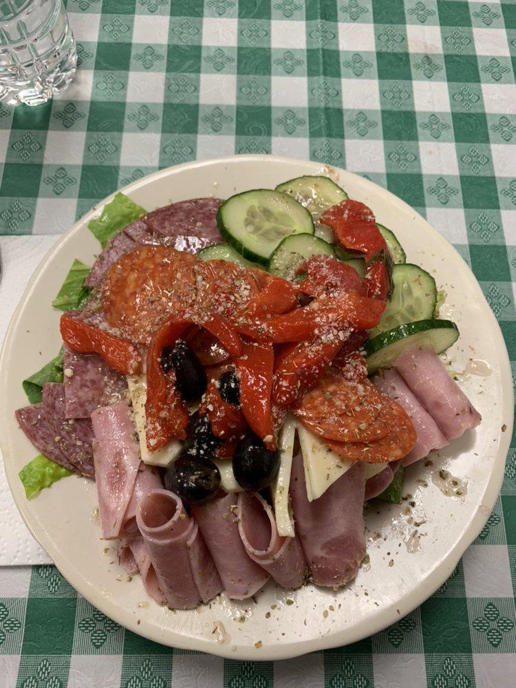 Antipasto Salad · Rolled ham, salami, provolone, olives, house made roasted red peppers, tomatoes, cucumbers and red onions, topped with pepperoni and grated cheese. Served with mixed greens.