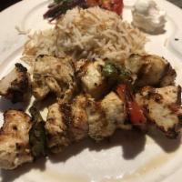 Shish Taouk · Chicken kebabs, sumac, onion, garlic whip and rice.