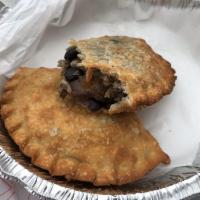 Typical Cubano Empanada · White rice, black beans and sweet plantains.