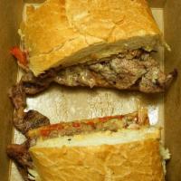 Ribeye Sandwich · Grilled ribeye with grilled onions, red bell peppers, and mushrooms, BBQ sauce, wile Jack sa...