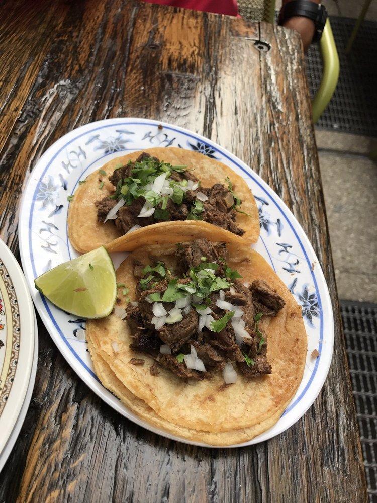Carne Asada Tacos · Grilled soy (gf) chipotle marinated steak, chopped onion, and cilantro.