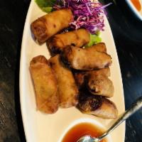 Spring Rolls · Fried spring rolls stuffed with cabbage, green beans, onions, carrots and vermicelli. This d...