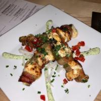 Desert Fire Jalapenos · Stuffed with 4 different cheeses, bacon wrapped, red peppers, chilled lime cilantro sauce. H...