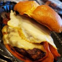 Hangover Burger · 7 oz. Wagyu beef, American cheese, bacon, over easy egg, house made sauce, caramelized onion...
