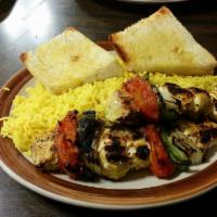 Chicken Kabob · Served with grilled onions, bell peppers, tomatoes, rice, green salad, and garlic roll.