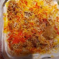 Goat / Lamb Biryani · Goat/lamb meat marinated in a seasoned yogurt sauce layered with buttery rice.