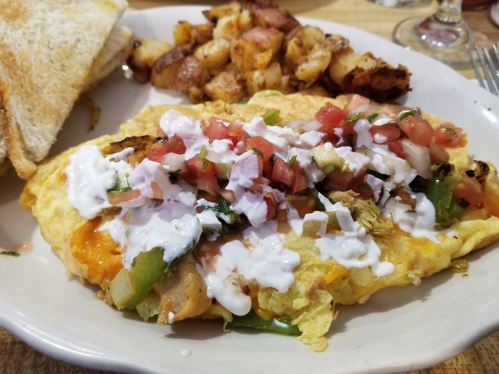 Chicken Fajita Omelette · Pulled chicken, peppers, onions, tomatoes, cheddar cheese, salsa and sour cream.