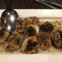 Baked Clams · 8 littlenecks stuffed with breadcrumbs, Romano cheese, lemon, olive oil, and white wine.