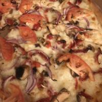 Garlic Valley Pizza · Grilled chicken with mushrooms, red onion, tomatoes, Roma tomatoes and creamy garlic.