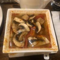 Tom Yum Soup · Thai clear spicy and sour broth with lemongrass, lime, chili paste, mushroom, onion, bell pe...