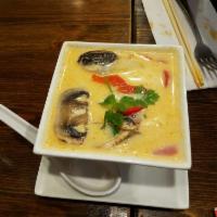 Tom Kha Soup · Classic Thai soup with coconut milk, chicken, mushroom, bell pepper and cilantro.