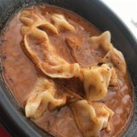 Jhol Momo · Jhol Momo refers to momos drowned in a bowl of hot, liquid sauce. your choice of veggei, Chi...