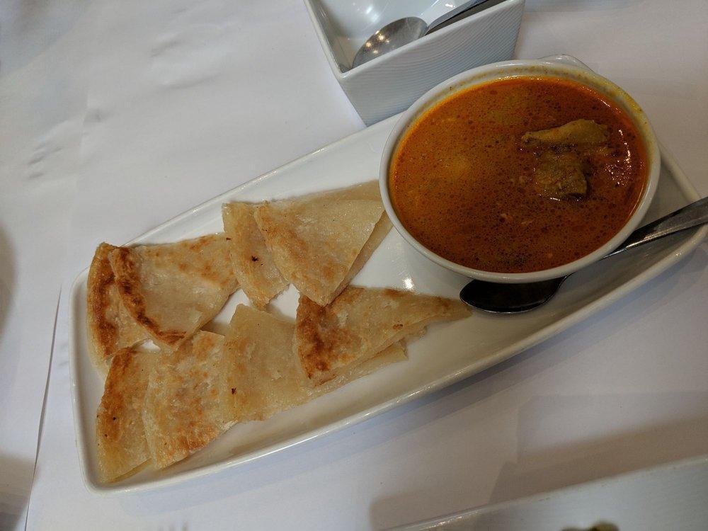 Palata · Multi-layer bread served with coconut chicken. Vegetarian curry or lamb curry available for an additional charge.