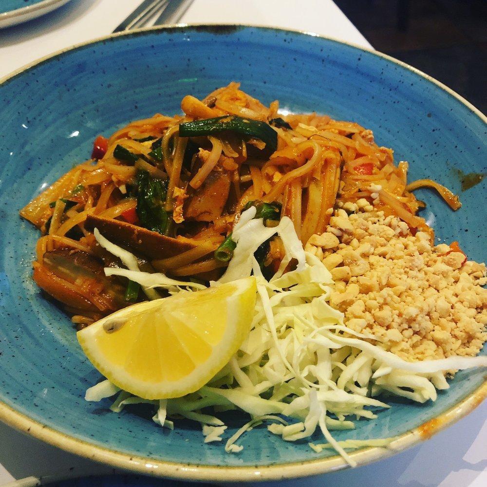 Burmese Pad Thai · Our most popular dish is a play on a classic. Rice noodles tossed with red bell peppers, onions, pea leaves, cabbage, peanuts, bean sprouts and scrambled egg. chicken or shrimp available for an additional charge. Spicy. vegan option available.