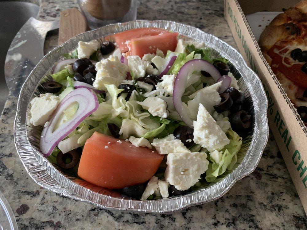 Greek Salad · Lettuce, tomatoes, onions, green peppers, black olives, pepperocini peppers, cucumbers and crumbled feta cheese.