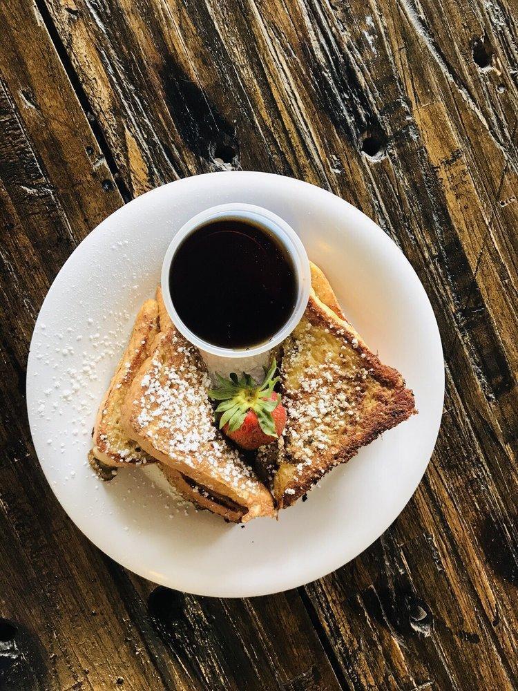 French Toast · Dusted with powdered sugar and served with hot maple syrup.