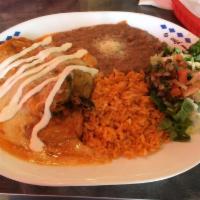 Enchiladas · Two enchiladas, side of rice and beans.