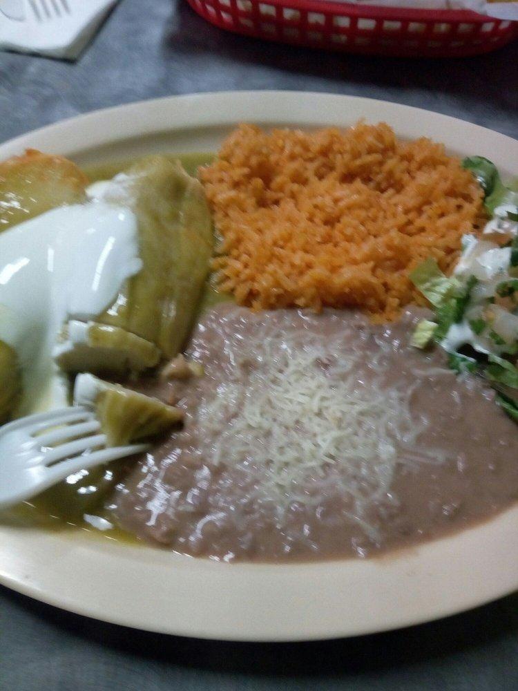 Tamales · Two tamales, side of rice and beans.