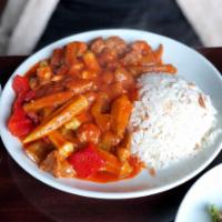 Okra Stew · Bamya. Fresh okra cooked with onion and garlic in a fresh tomato sauce served with rice pilaf.